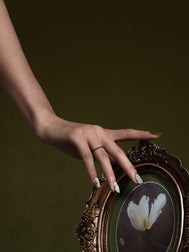 Green press-on nail with hand-painted  floral design”