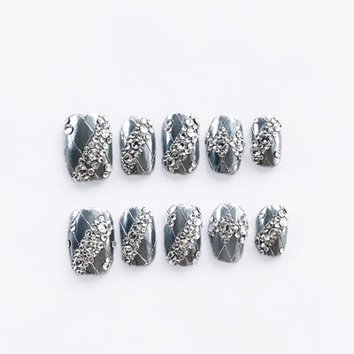 Luxury silver press on nails featuring a lace pattern and crystal accents