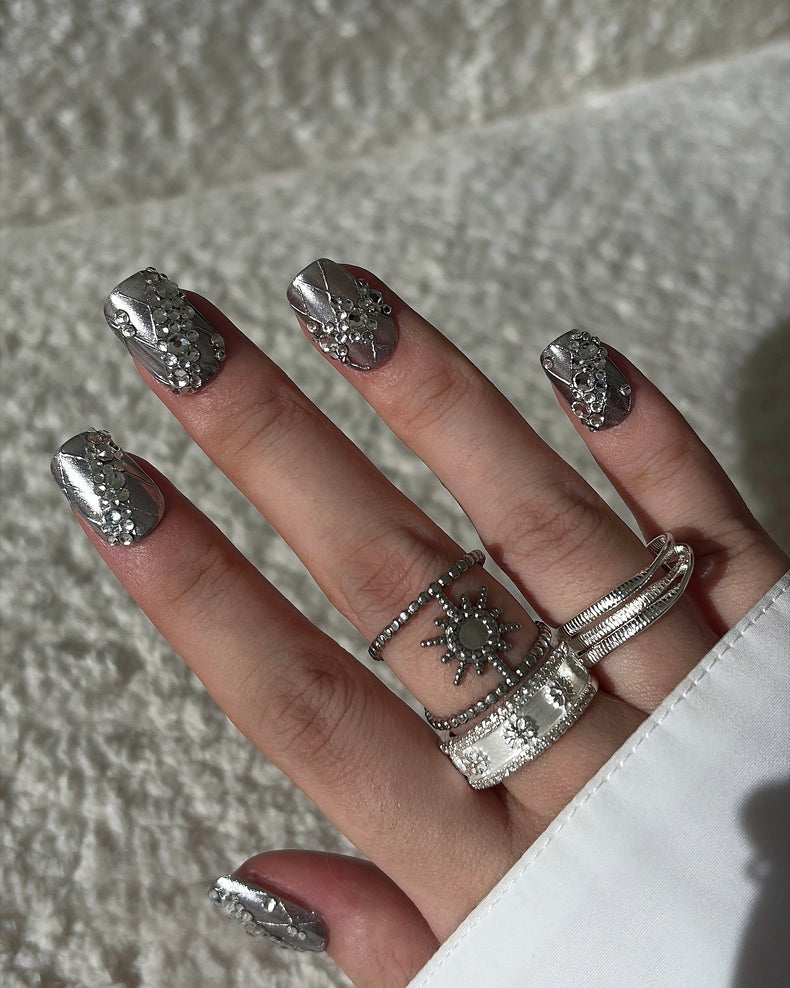 Luxury silver press on nails featuring a lace pattern and crystal accents