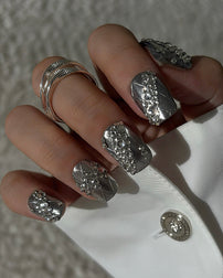 Luxury silver press on nails featuring a lace pattern and crystal accents