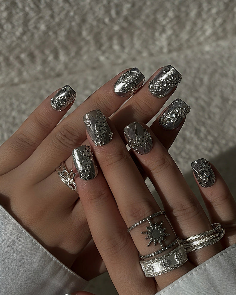 Luxury silver press on nails featuring a lace pattern and crystal accents